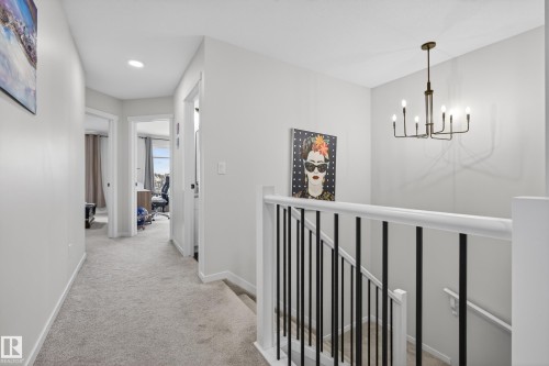 Upper-level hallway featuring light gray carpeting and recessed lighting - 22836 94 Avenue, Edmonton, AB 