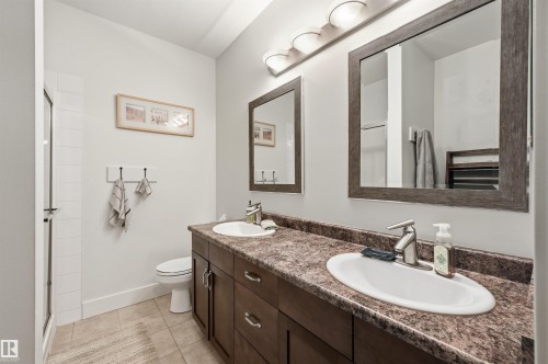 Dual vanity with undermount sinks and dark wood-finish cabinetry - 217 2503 Hanna Crescent, Edmonton, AB 