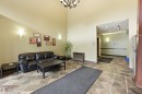 Lobby area featuring vaulted ceilings and patterned tile flooring - 217 2503 Hanna Crescent, Edmonton, AB 