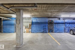 Concrete flooring with yellow parking space delineation - 