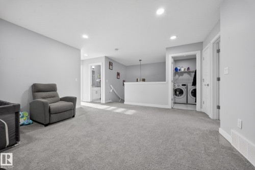 Carpeted room with light gray walls, featuring recessed lighting and white trim - 2084 Graydon Hill, Edmonton, AB 