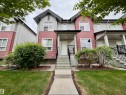 Contemporary townhome exterior featuring an inviting front porch - 45 6075 Schonsee Way, Edmonton, AB 