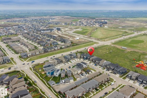 Aerial perspective of a developed residential community with ongoing expansion - 20011 26, Edmonton, AB 