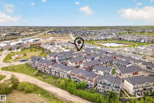 Aerial perspective showcasing a residential community with townhomes and detached properties - 85 165 Cy Becker Boulevard, Edmonton, AB - Outdoor With View