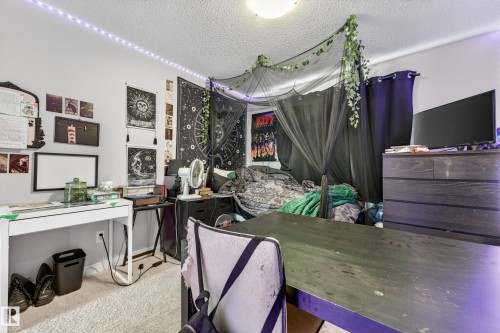 Room featuring light-colored carpet flooring and white painted walls - 85 165 Cy Becker Boulevard, Edmonton, AB - Indoor