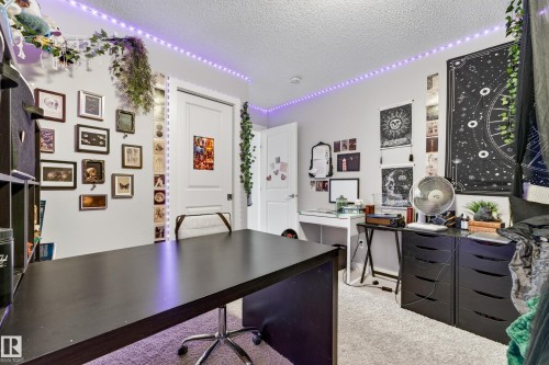 Neutral wall color with textured ceiling and light-toned carpet flooring - 85 165 Cy Becker Boulevard, Edmonton, AB - Indoor Photo Showing Office
