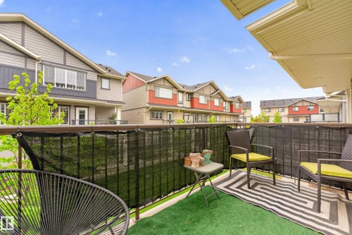 Private balcony with artificial turf flooring and a black privacy screen - 85 165 Cy Becker Boulevard, Edmonton, AB - Outdoor With Exterior