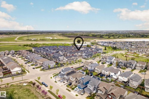 Aerial perspective of a residential neighborhood featuring a mix of detached homes and townhomes - 85 165 Cy Becker Boulevard, Edmonton, AB - Outdoor With View