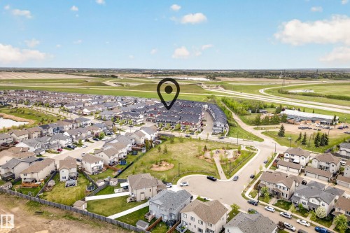 Aerial perspective showcasing a residential community with diverse housing styles - 85 165 Cy Becker Boulevard, Edmonton, AB - Outdoor With View