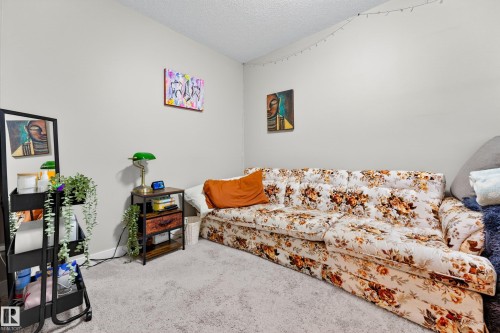 Carpeted room with light-toned walls and a textured ceiling - 85 165 Cy Becker Boulevard, Edmonton, AB - Indoor