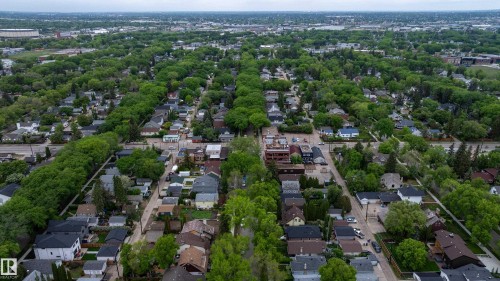 Expansive residential landscape featuring mature tree-lined streets and varied architectural styles - 11158 65 Street, Edmonton, AB 