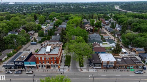 Aerial perspective showcasing a tree-lined street with commercial and residential properties - 11158 65 Street, Edmonton, AB 