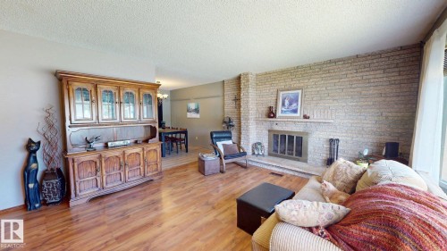 4809 Mackenzie Ave, Drayton Valley, AB - Indoor Photo Showing Living Room With Fireplace