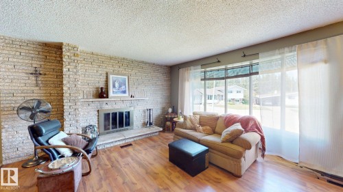 4809 Mackenzie Ave, Drayton Valley, AB - Indoor Photo Showing Living Room With Fireplace