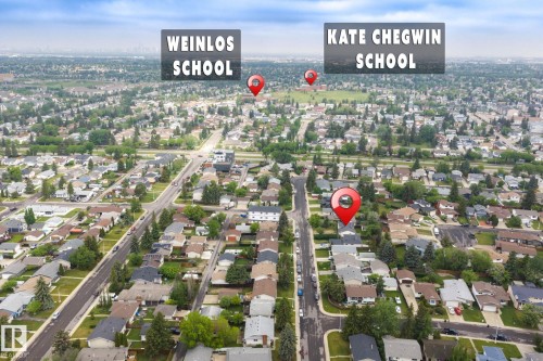 Aerial view of a residential neighborhood with tree-lined streets - 2045 46St, Edmonton, AB 