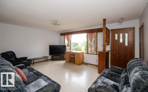 Spacious living area featuring light-toned flooring and white walls - 2021 Twp Rd 604, Rural Westlock County, AB 