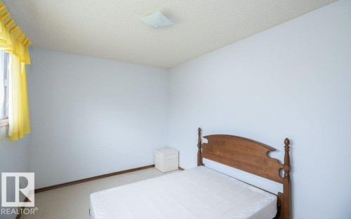 Neutral wall colors, textured ceiling, and a flush-mount ceiling light fixture - 2021 Twp Rd 604, Rural Westlock County, AB 