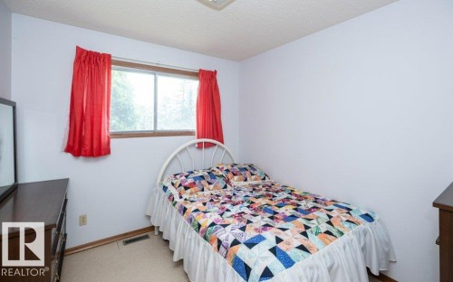 Room with light-toned walls, wood-trimmed window, and neutral carpet flooring - 2021 Twp Rd 604, Rural Westlock County, AB 