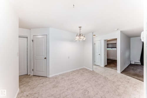Open concept living area with neutral color palette - 126 10535 122 Street, Edmonton, AB 