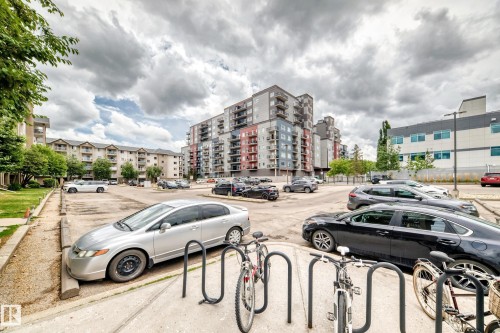 Multistory residential buildings featuring modern architecture with varied facade materials including grey and red panels - 126 10535 122 Street, Edmonton, AB 