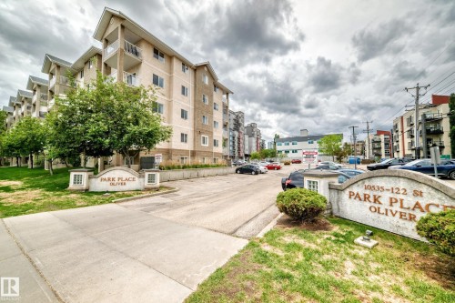 Multi-story residential building with light-toned exterior and private balconies - 126 10535 122 Street, Edmonton, AB 