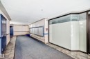 Common area featuring individual mailboxes, dark blue entry doors, and a carpeted hallway - 126 10535 122 Street, Edmonton, AB 