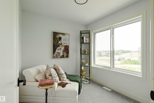 Room with light gray walls, white trim, and light gray carpeted flooring - 3329 Chickadee Drive, Edmonton, AB 