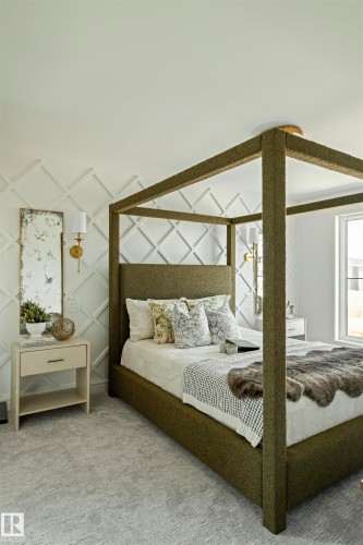 Wall-mounted sconces illuminate a textured accent wall - 3329 Chickadee Drive, Edmonton, AB 