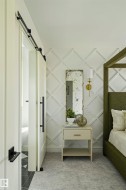 White lattice accent wall with light gray carpeting - 