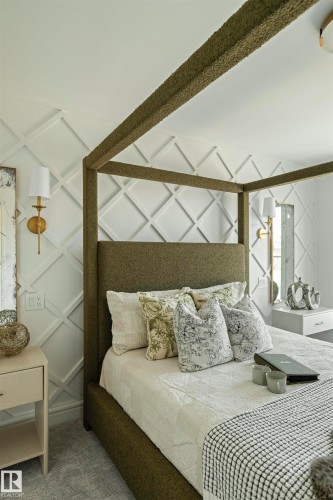 Textured wall paneling with a diamond pattern, accented by brass wall sconces - 3329 Chickadee Drive, Edmonton, AB 