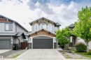 Contemporary two-story residence with light gray siding and wood-shingle accents - 21807 97 Avenue, Edmonton, AB 