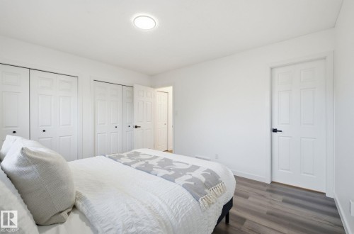 Bedroom with multiple closets and wood finished floors - 2722 104A Street, Edmonton, AB 