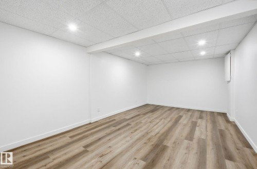 Very large extra bedroom in the basement for gym or for a great guests bedroom since a king bed and sitting area could fit in perfectly. - 2722 104A Street, Edmonton, AB 