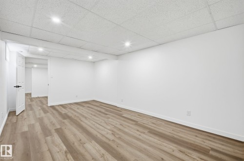 Very large extra bedroom in the basement for gym or for a great guests bedroom since a king bed and sitting area could fit in perfectly. - 2722 104A Street, Edmonton, AB 