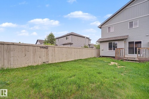 Fenced backyard featuring a grassy area - 16810 53 Street, Edmonton, AB 