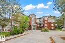 Multi-story residential building featuring a brick and stucco exterior - 116 6315 135 Avenue, Edmonton, AB 