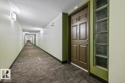 Entry door with decorative paneling and a frosted glass block sidelight - 