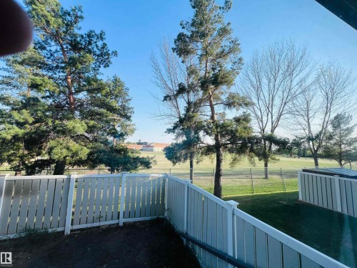 Private outdoor space featuring a white privacy fence and a grassy area - 2544 79 Street, Edmonton, AB - Outdoor