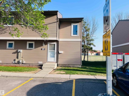 Two-story residential building with light brown siding and white trim - 2544 79 Street, Edmonton, AB - Outdoor