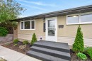 Inviting front exterior featuring a covered entryway, stucco facade, and horizontal siding accents - 16105 109A Avenue, Edmonton, AB 