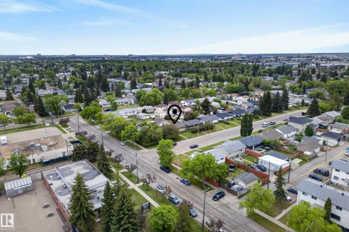 Aerial perspective showcasing a residential area with established trees and a clear sky overhead - 16105 109A Avenue, Edmonton, AB 