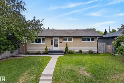 Single-story exterior with a low-pitch roof and light-colored stucco siding - 16105 109A Avenue, Edmonton, AB 