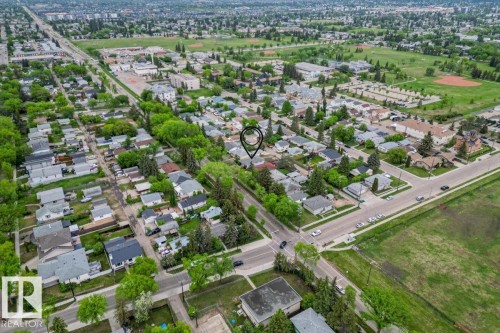Aerial perspective showcasing a residential neighborhood with mature trees - 12923 113A Street, Edmonton, AB 