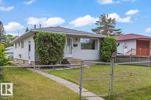 Single-story residence featuring light-colored horizontal siding and a dark shingle roof - 12923 113A Street, Edmonton, AB 
