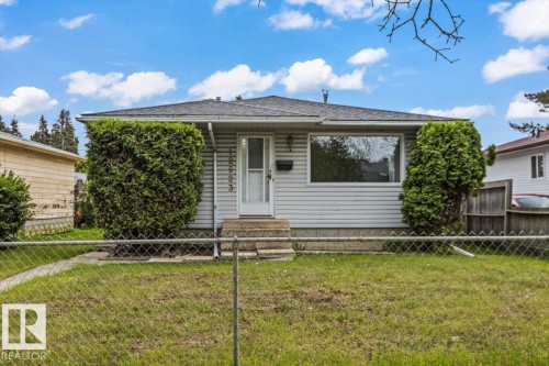Exterior featuring horizontal siding, a gabled roof, and a front entrance with concrete steps - 12923 113A Street, Edmonton, AB 