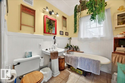 Pedestal sink and freestanding bathtub with an overhead window - 572004 Highway 857, Rural Two Hills County, AB 