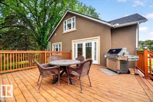 Spacious wooden deck with natural wood railing - 572004 Highway 857, Rural Two Hills County, AB 