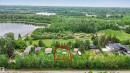 Grassy lot bordered by mature trees - 337 Smith Crescent, Rural Parkland County, AB 