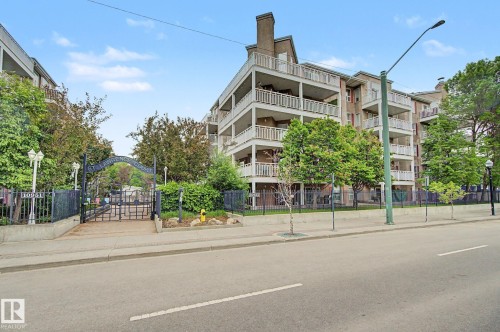 Multi-story residential building with private balconies and a brick chimney feature - 308 10933 124 Street, Edmonton, AB 