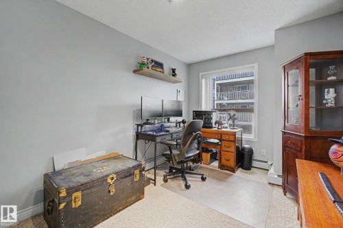 Room with light gray walls, a window, and mixed flooring - 308 10933 124 Street, Edmonton, AB 